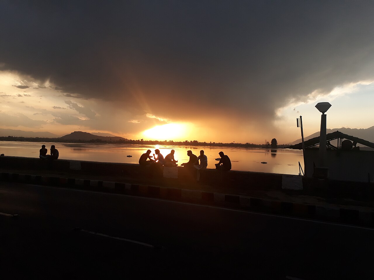 Sunset over a houseboat on Dal Lake