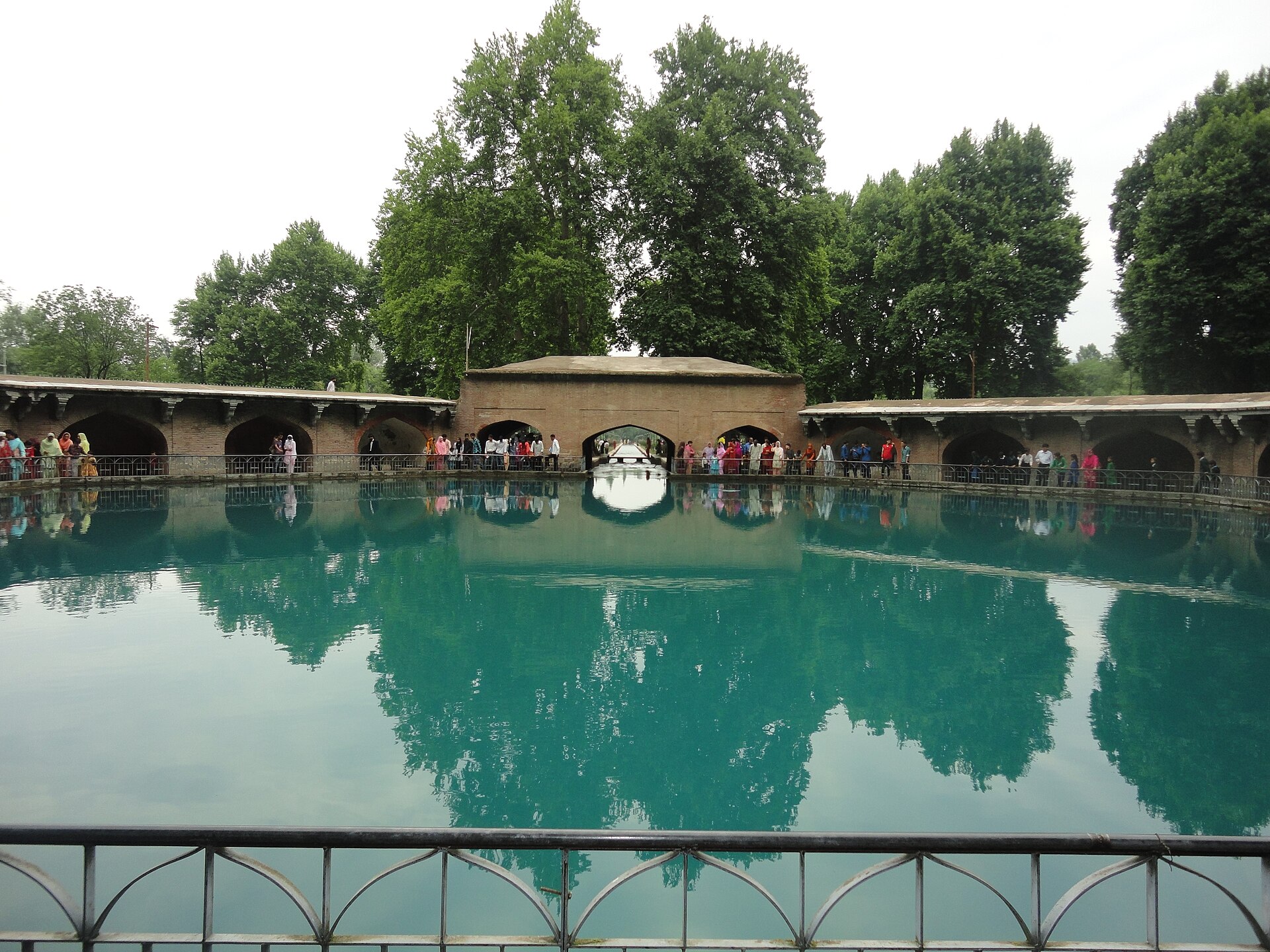Flowing water channels and historic trees at Achabal garden
