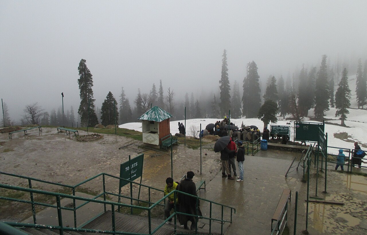 Cable car station with snowy mountain backdrop