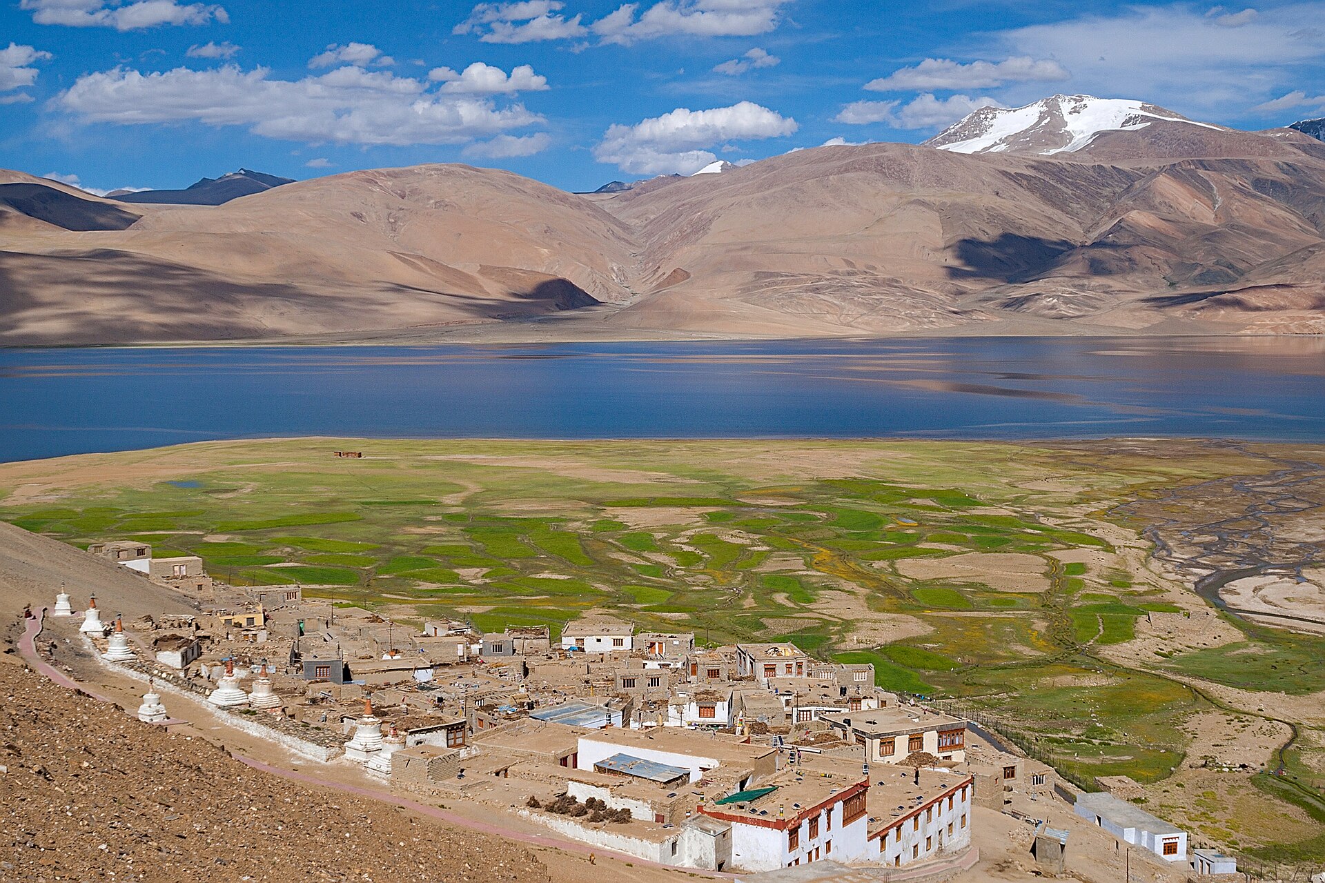 Korzok village and Tso Moriri lake under blue summer sky