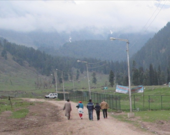 Exterior of a classic wooden lodge in the Kashmir hills