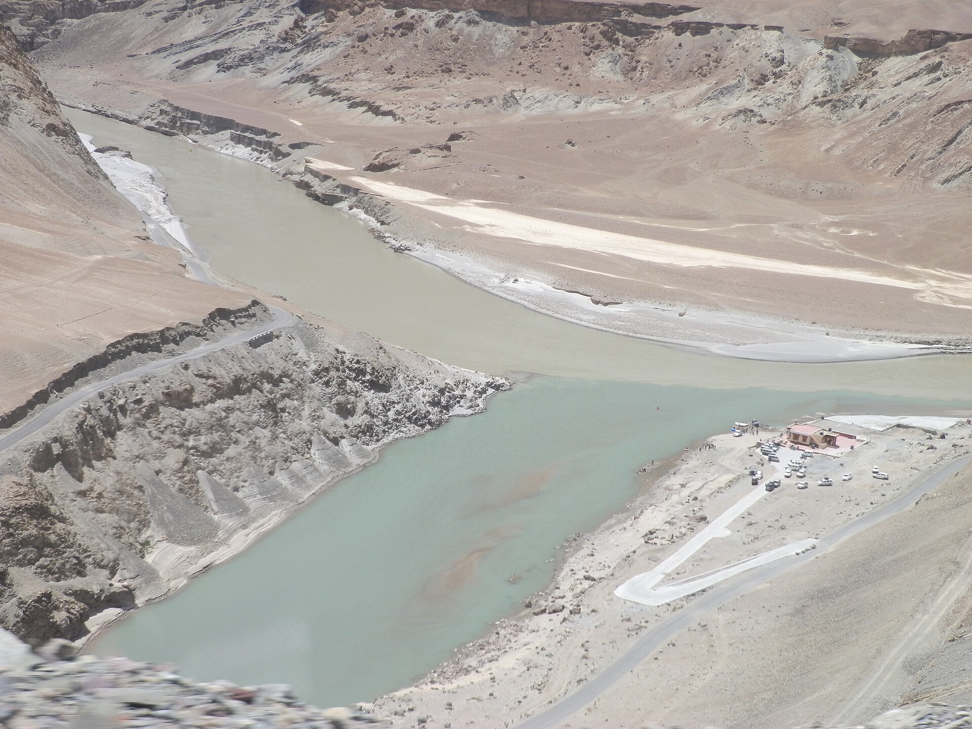 The meeting point of the blue Indus and muddy green Zanskar rivers
