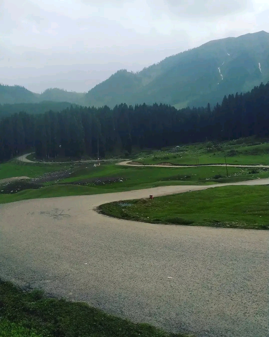 Tourists enjoying the open spaces of the Yusmarg meadow