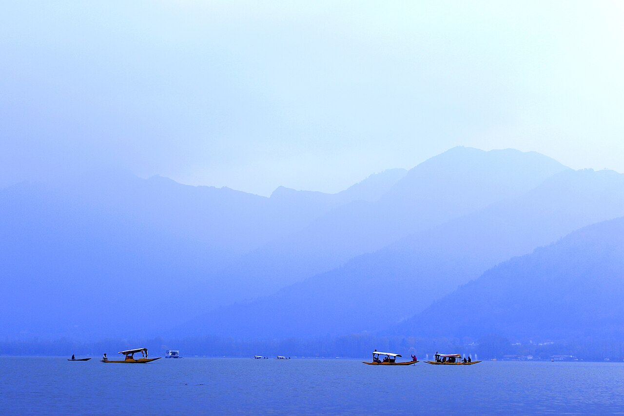Distant snow-capped mountains from a houseboat deck