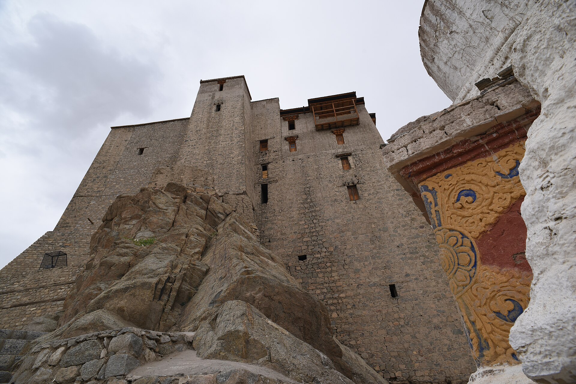 Ancient stone monastery perched on a rocky cliff in Ladakh