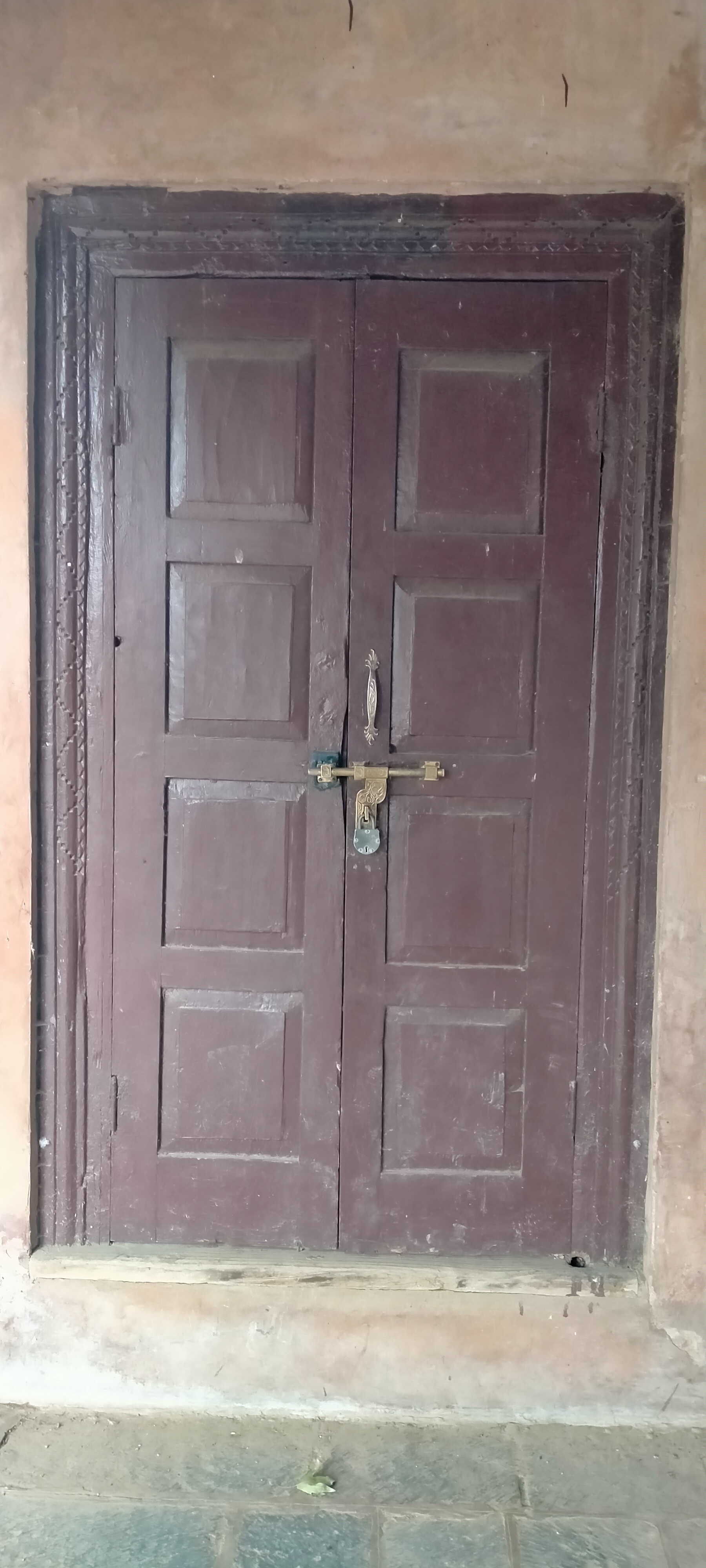 The ornate entrance gate of a historic Kashmiri garden.