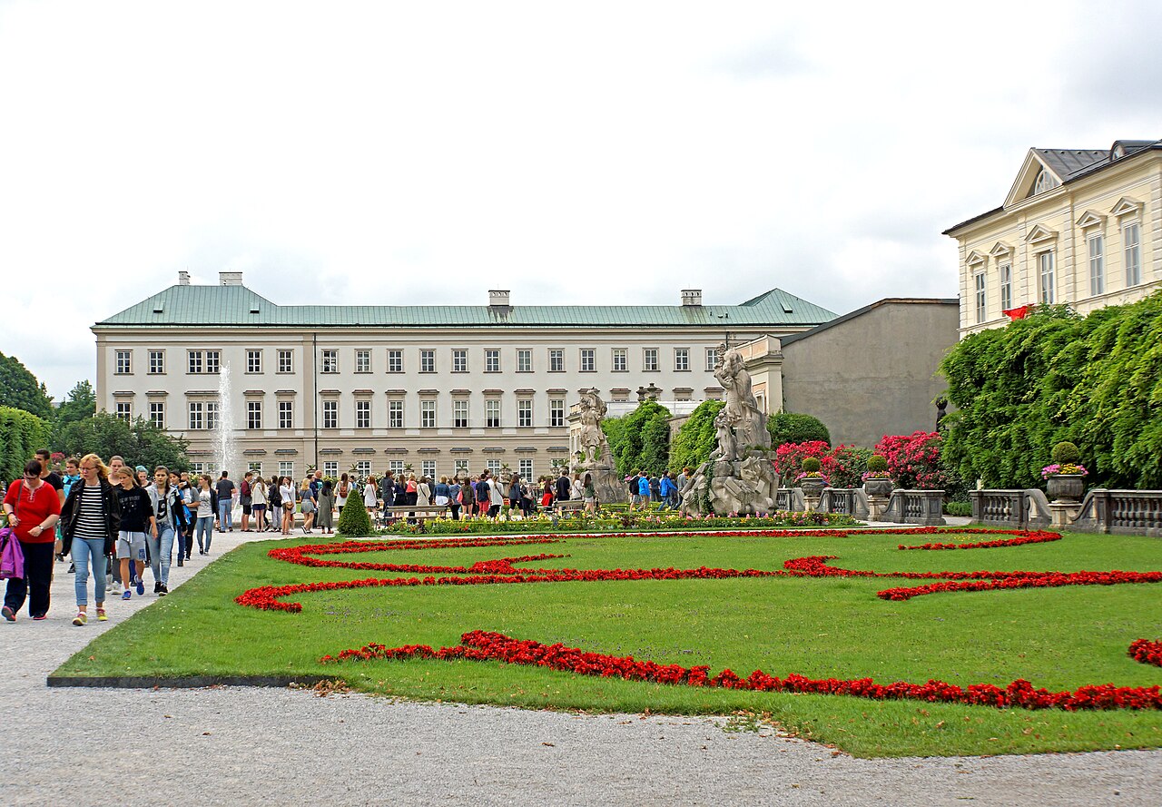 A visitor studying a garden map near the entrance.