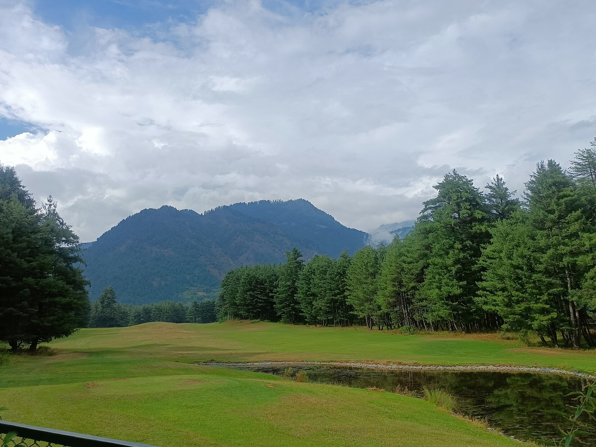 Large resort hotel situated along river bank in Pahalgam