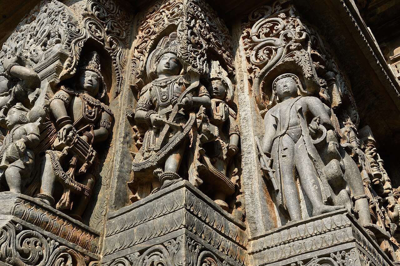 Close up of an artisan restoring historical stone reliefs.