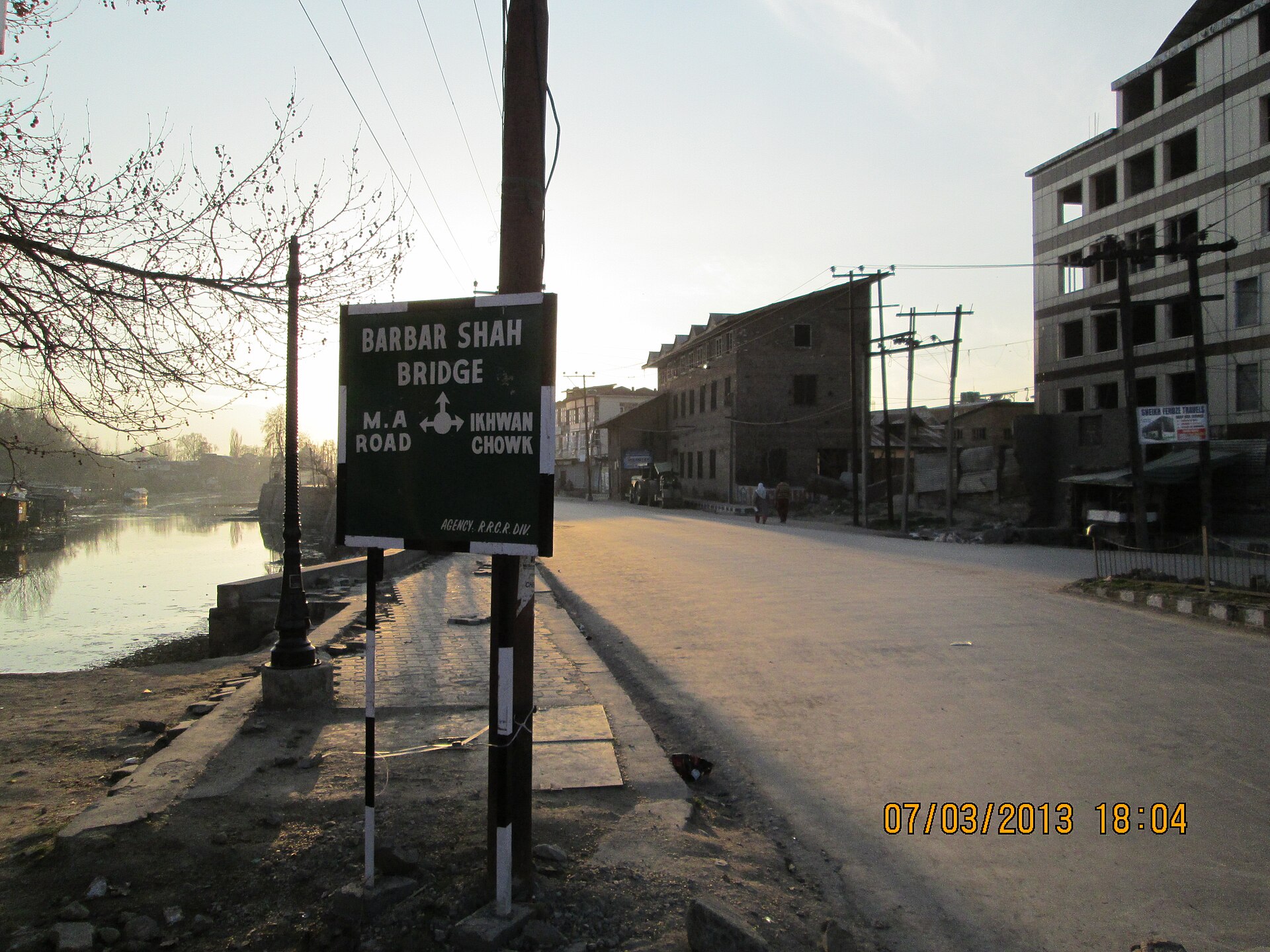 A winding road leading towards the northern mountains of Kashmir