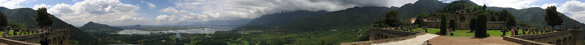 A scenic road leading toward the Zabarwan mountains