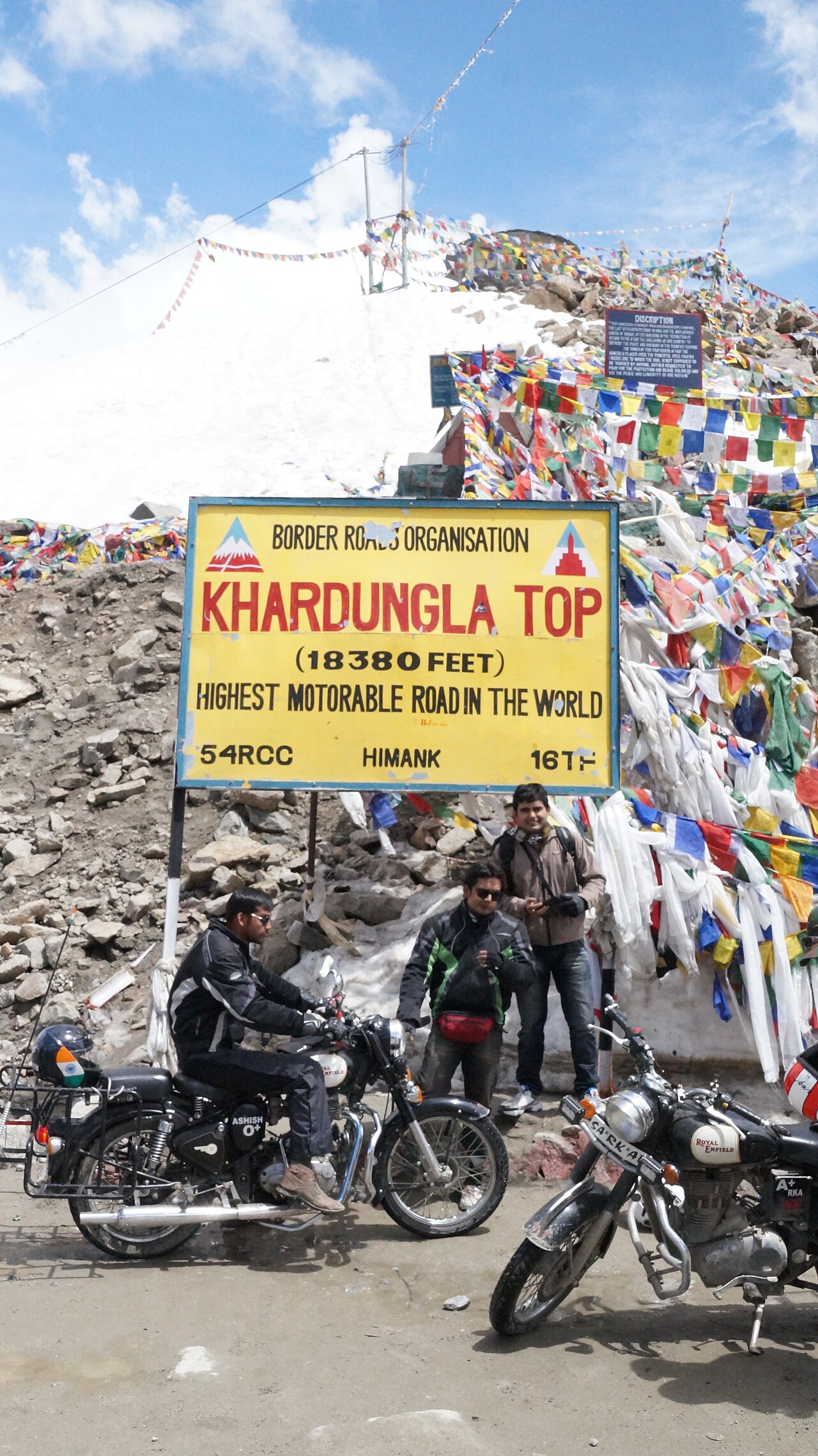 Motorcycle rider on a dry mountain road in Ladakh