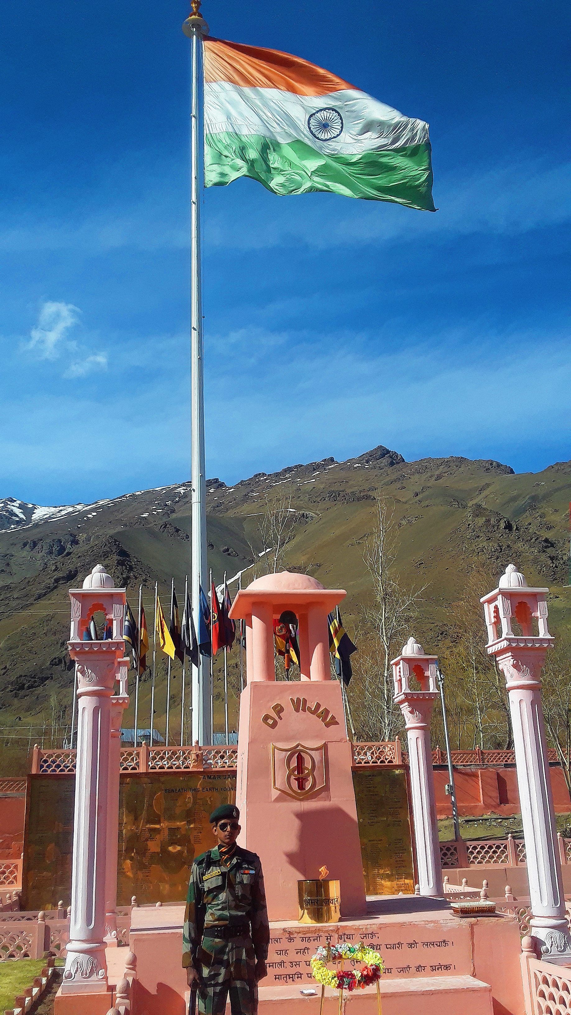 Mountain highway with vehicle checkpoint in Kashmir valley