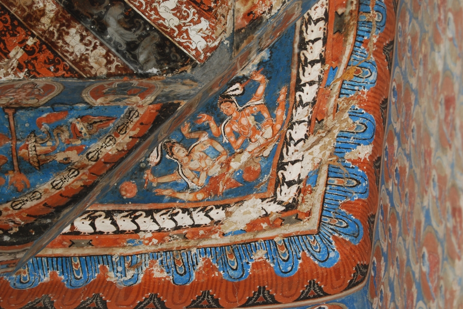 The interior of a quiet monastery in Ladakh with butter lamps.