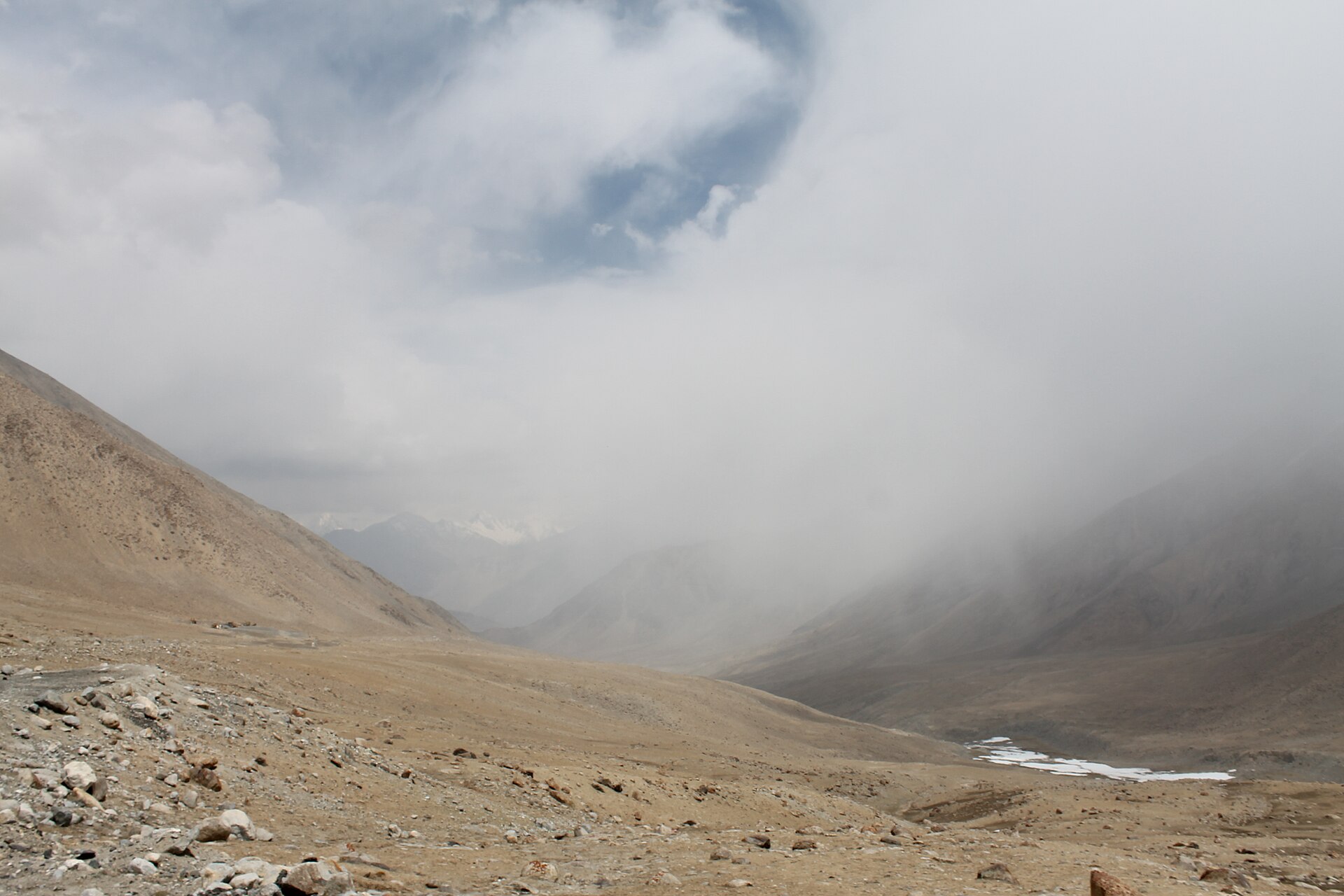 Winding mountain road in Ladakh under blue sky