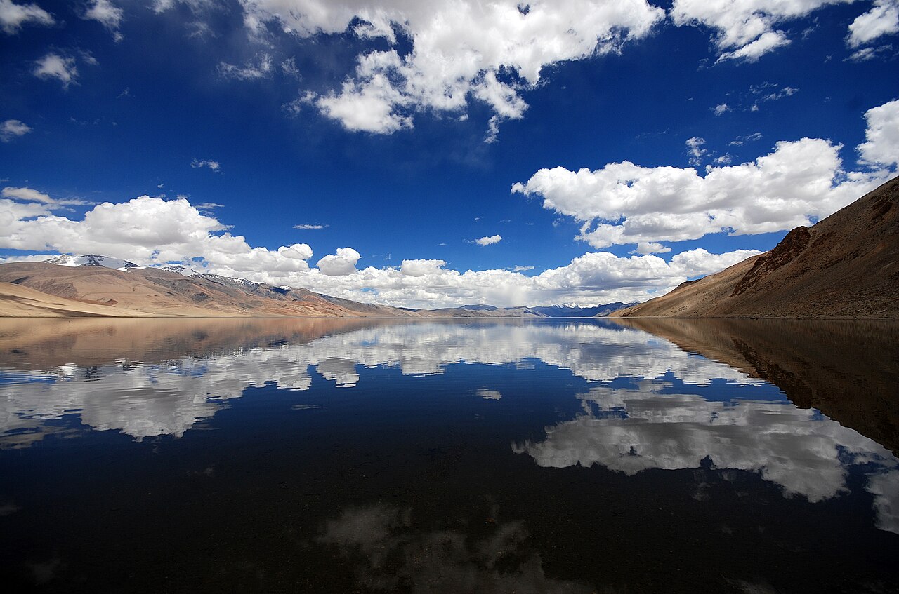 The calm, reflective surface of Tso Moriri lake at twilight.