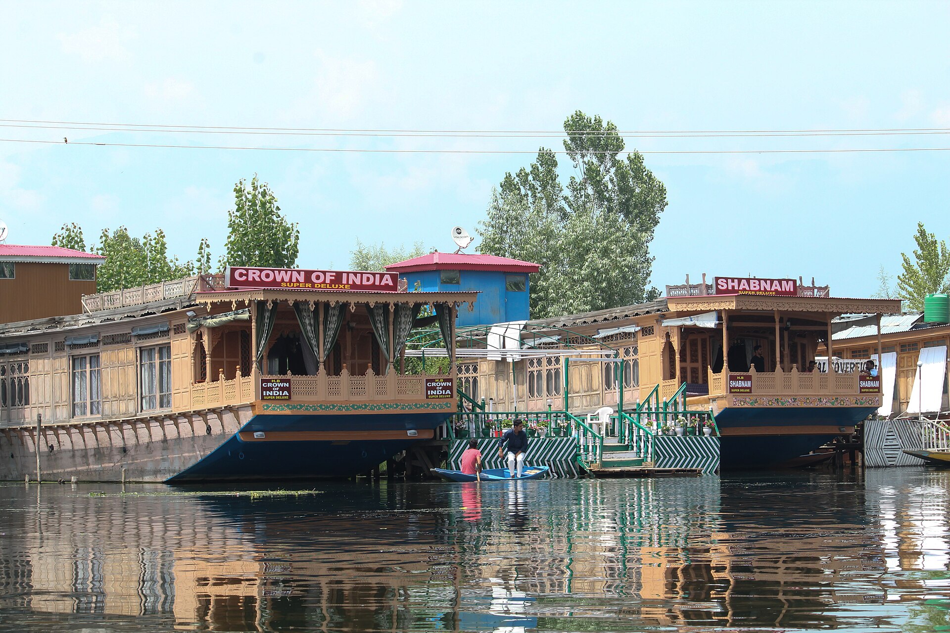 Busy waters and houseboats on Dal Lake Srinagar