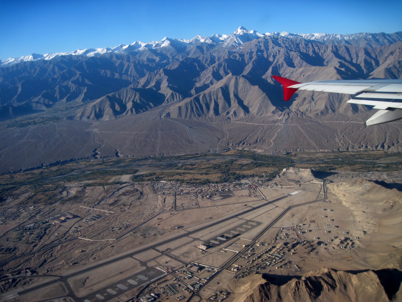Kushok Bakula Rimpochee Airport runway surrounded by barren mountains in Leh