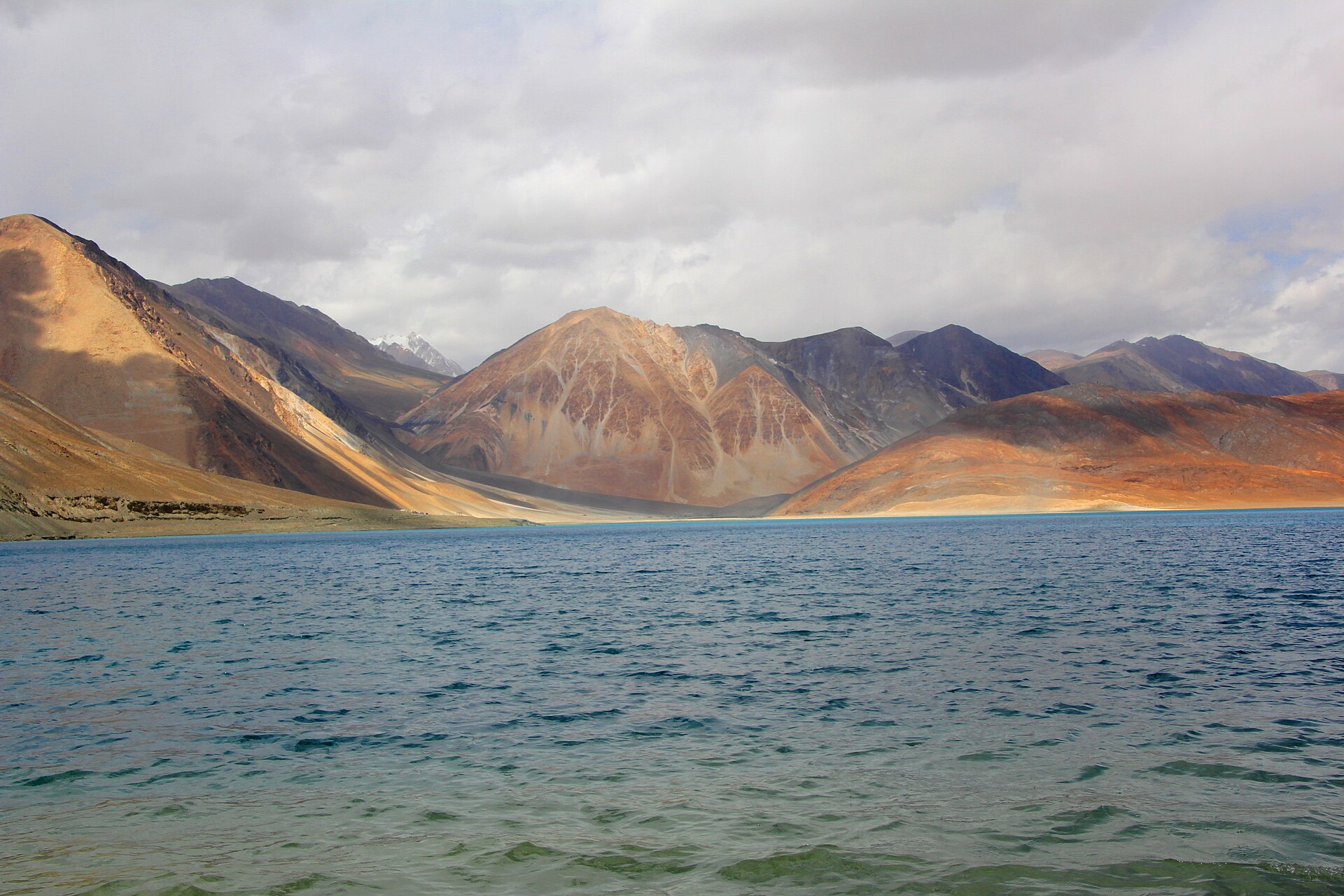 Crystal clear blue water of Pangong Tso in the sun
