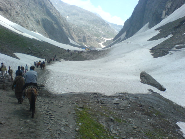 Pilgrim tents pitched at a mountain base camp during summer