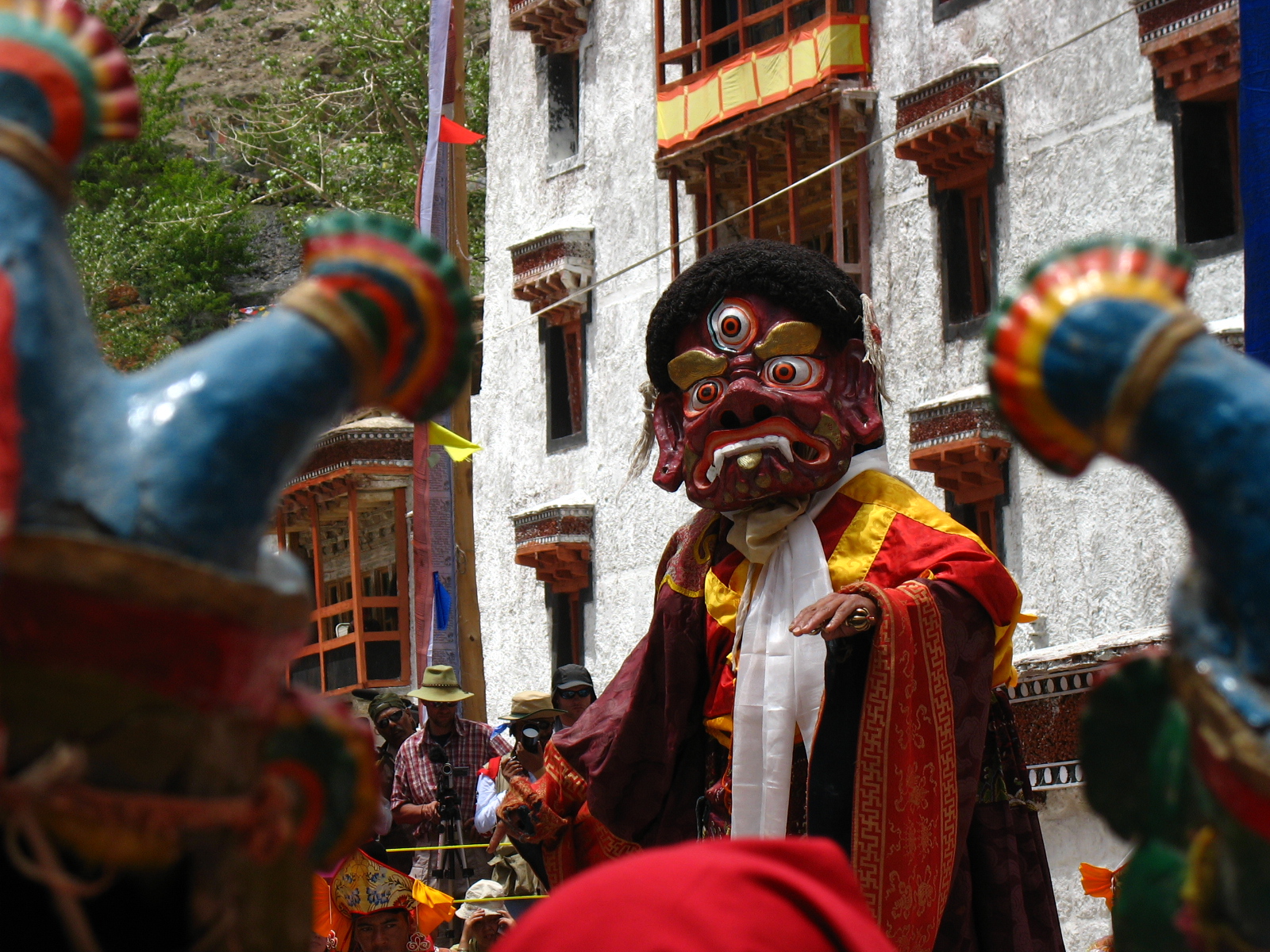 Masked monks dancing in Hemis monastery courtyard during festival