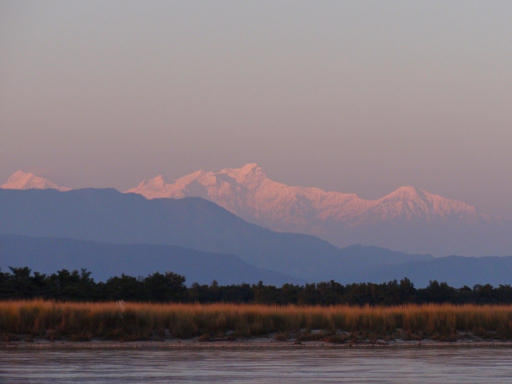 The last light hitting the peak of a high mountain.
