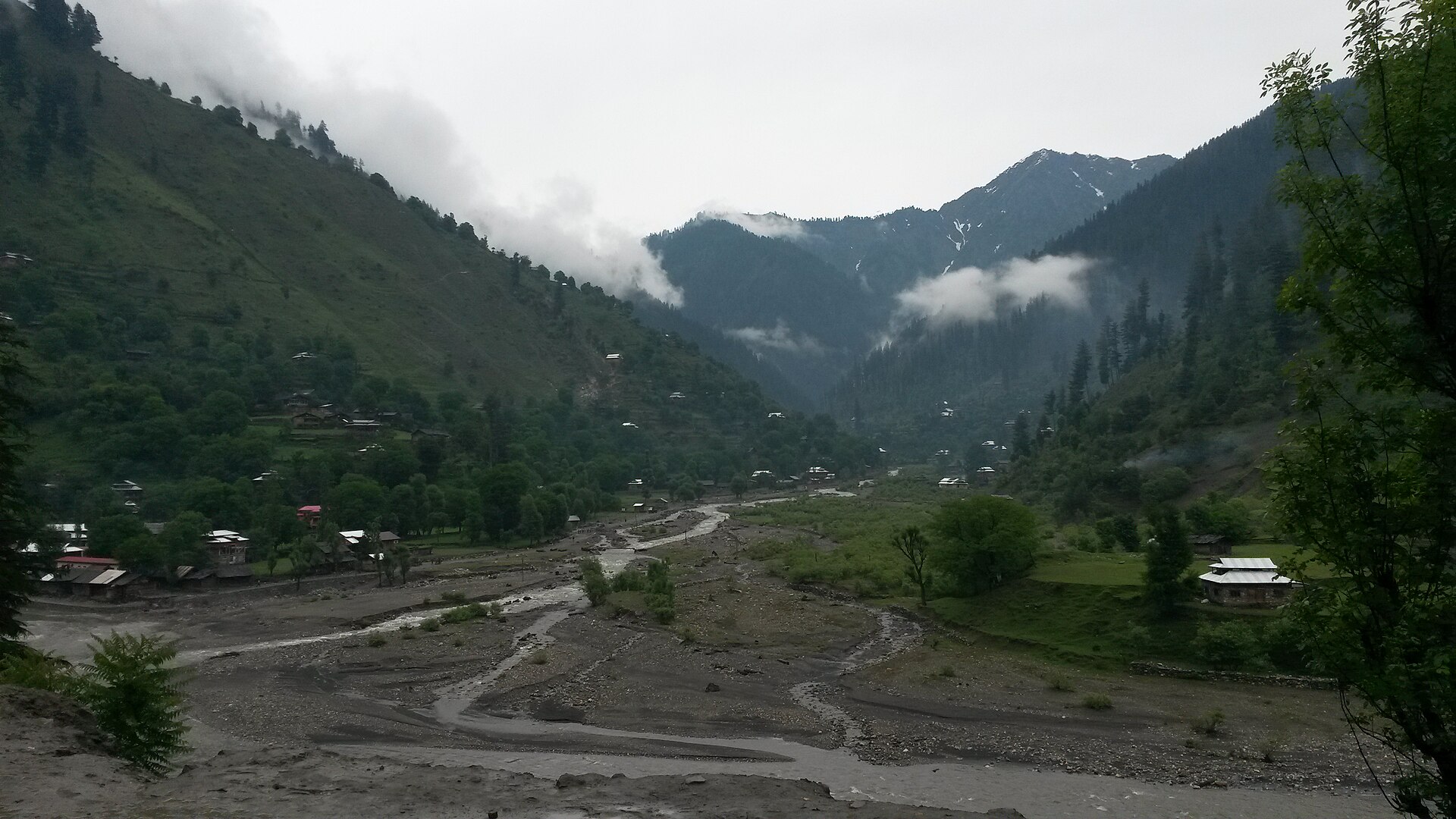 A snow-covered road in rural Kashmir
