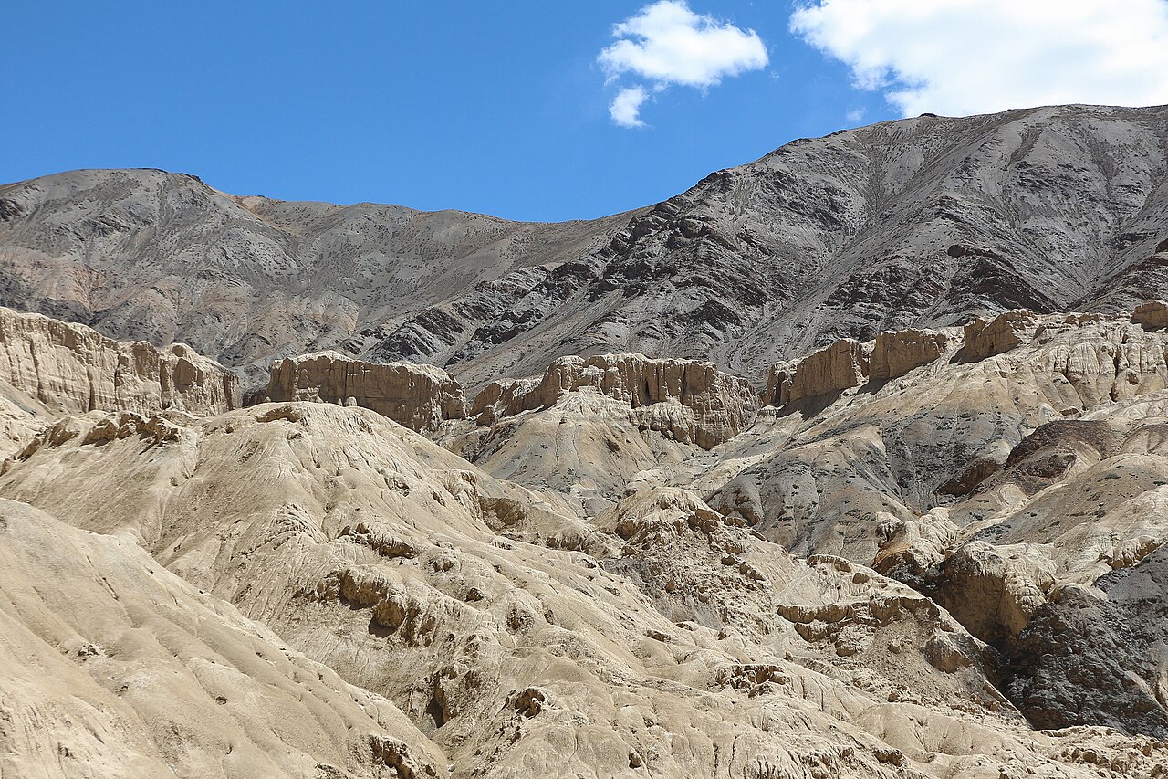 SUV travelling along a paved mountain highway in Ladakh