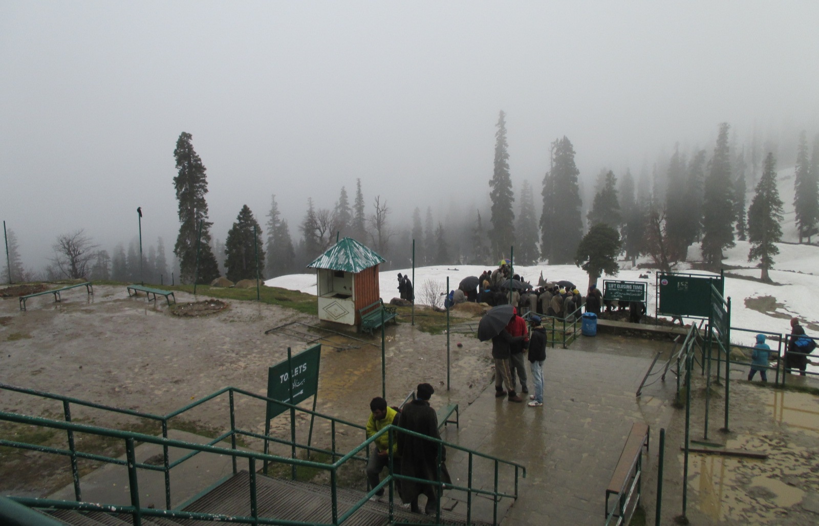 Skiers waiting near the Gulmarg gondola boarding area