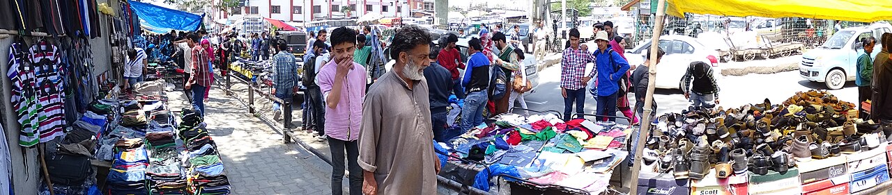 People walking through a busy bazaar