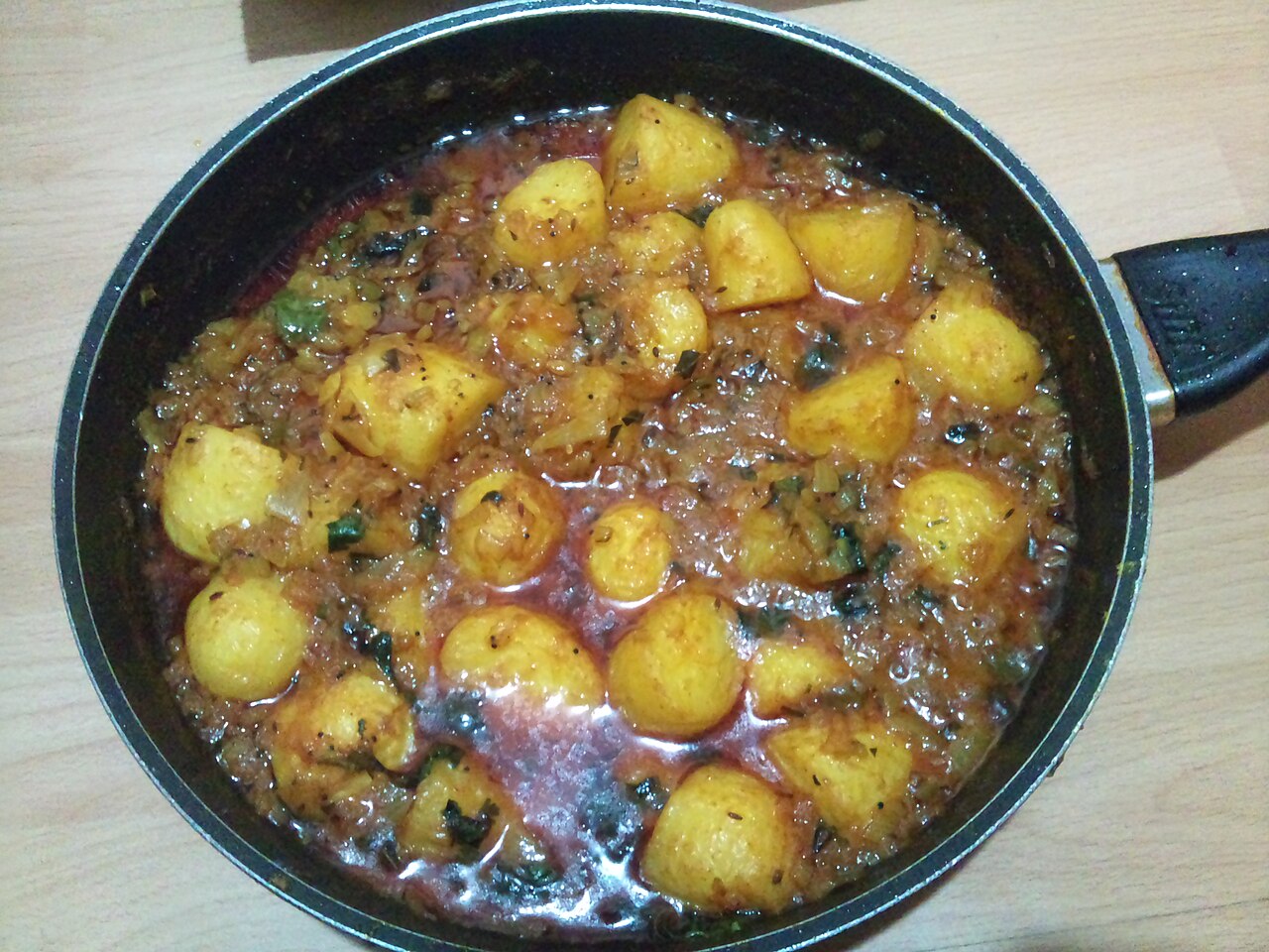 Traditional Kashmiri potato curry dish