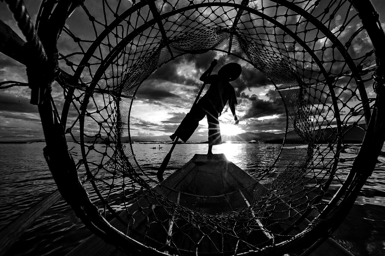 Local fisherman navigating his boat on Wular Lake