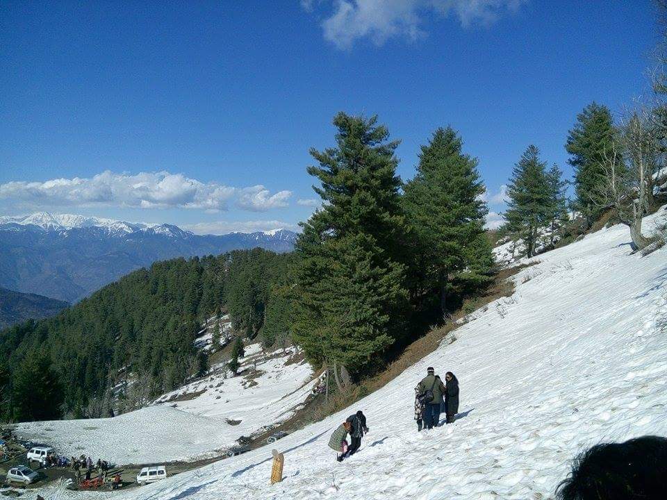 Panoramic view from Natha Top towards the distant mountains