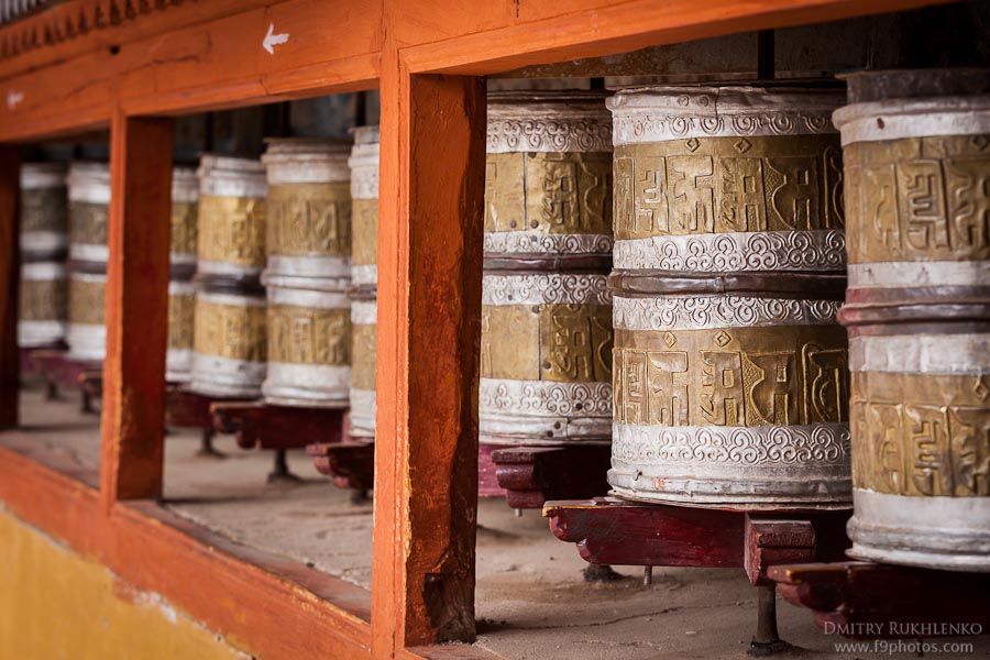 Interior of a Ladakh monastery prayer hall filled with butter lamps