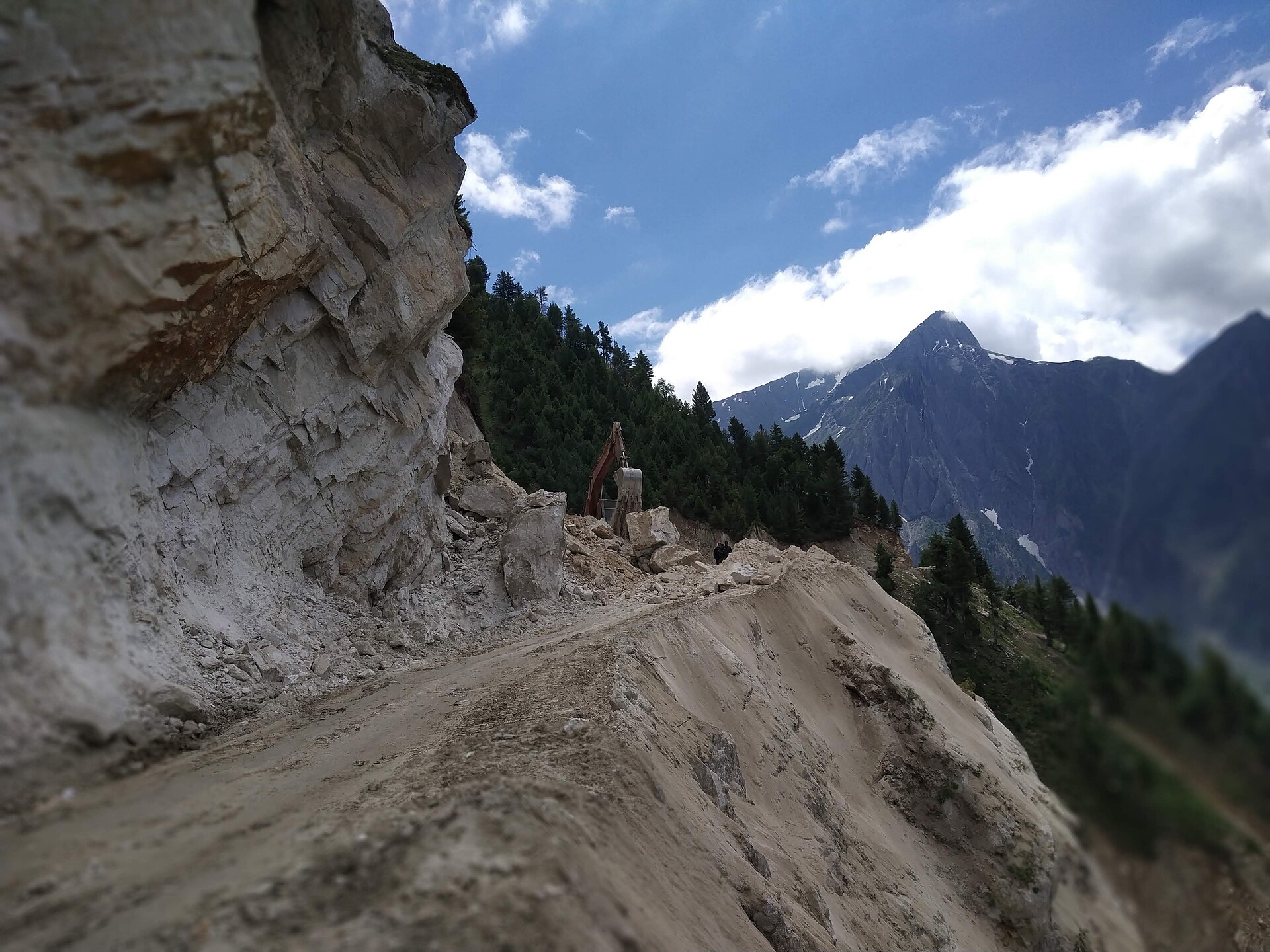 Smooth asphalt highway running through the green Kashmir valley