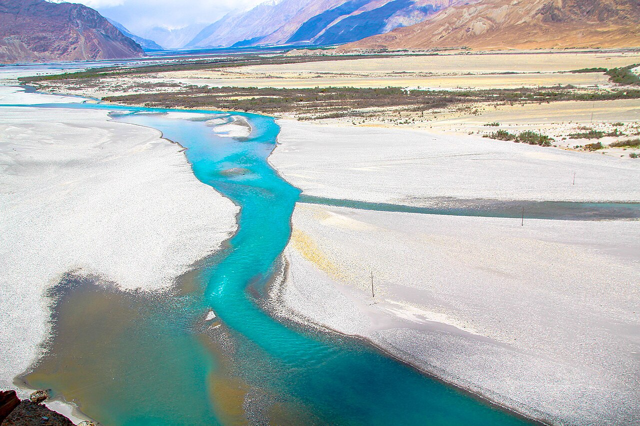 A small stream crossing a road in Ladakh