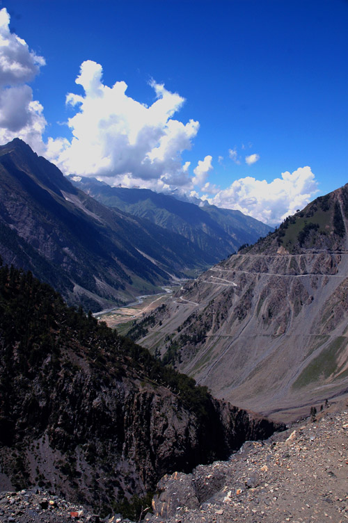 A sturdy jeep driving on a mountain road in Ladakh.
