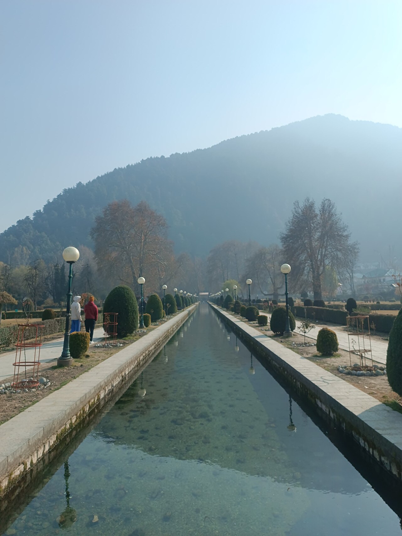 Reflections of brick arches in the water of Verinag