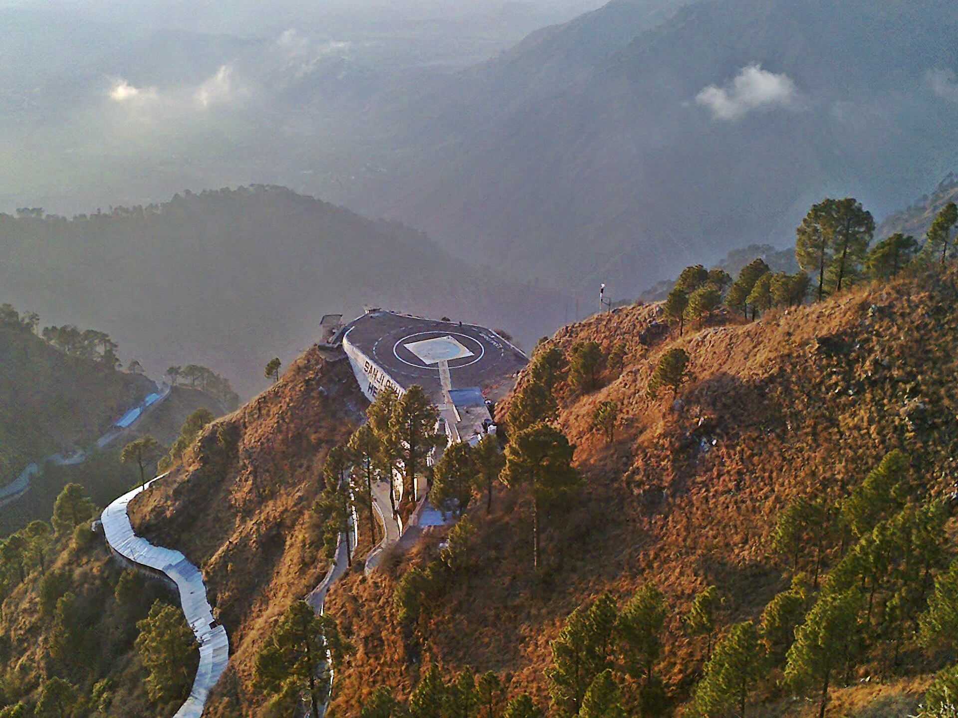 A long, winding mountain trail leading up to the shrine