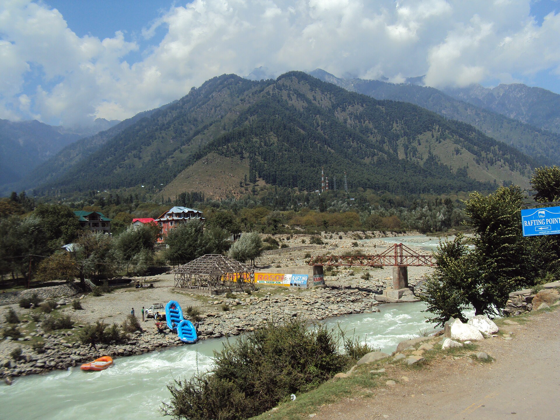 Rafting boat navigating the rapids on the Lidder River.